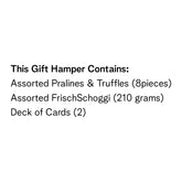 Assorted pralines and truffles (8 pieces) and two deck of cards